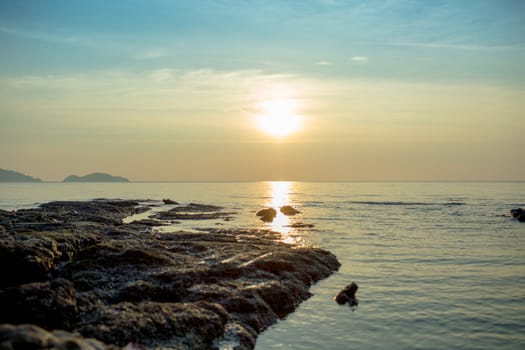 Blue sky and sun in the sea.