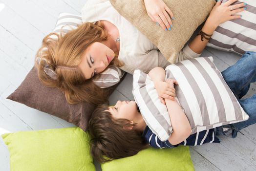 Cute, adorable boy with mother on the floor