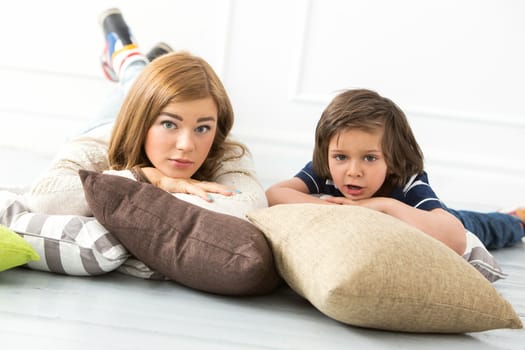 Cute, adorable boy with mother on the floor