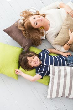Cute, adorable boy with mother on the floor