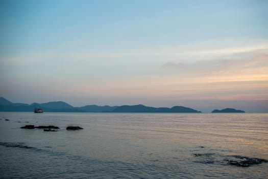 The large blue sky and seascape.