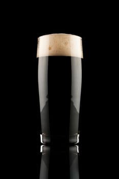 glass of black beer with reflection