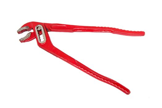 Large Red Wrench used by plumbers isolated on white