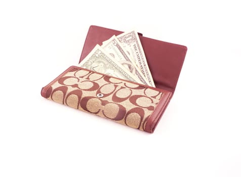 Dollar bank notes Inserted in a brown wallet.
On white background                               