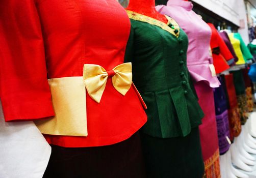 Mannequins wearing silk of Laos have bright colors and look elegant.                              