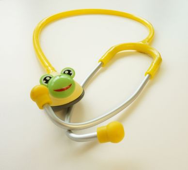 Yellow stethoscope for children patient . Placed on the table in the examination room.                              