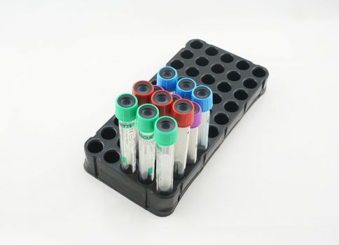 Tube inserted to collect blood specimens. With the lid closed tube several colors, including blue, red, green, and purple.                               