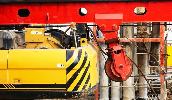 Excavator used to dig the soil to create a bridge piling sky.                               