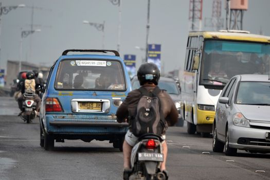 bandung, indonesia-june 13, 2014-scenery of busy traffic in bandung city, west java-indonesia