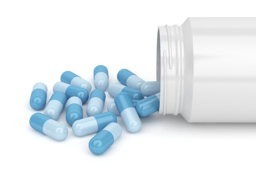 Blue capsules spilling out of plastic bottle 