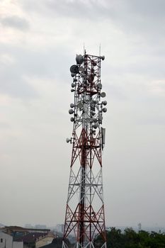 typical communication tower in telecommunication industry againts blue sky
