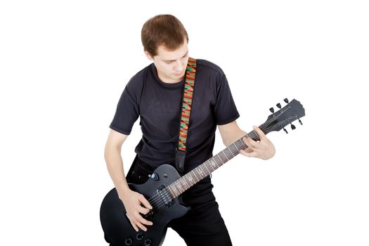 Man with a guitar on a white background. Performer with an electric guitar