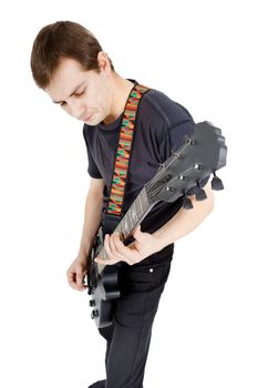 Man with a guitar on a white background. Performer with an electric guitar