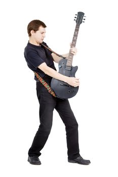 Man with a guitar on a white background. Performer with an electric guitar