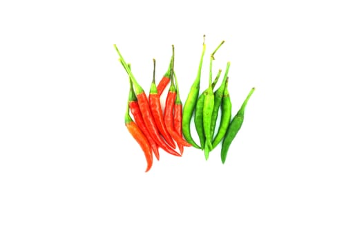 Red and green chilli placed on a white background, spicy chili made ??appetizers as well.                              