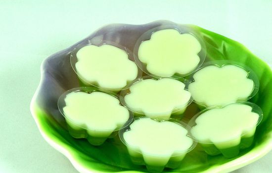 Coconut jelly as dessert in Thailand. The bottom is made of mixed greens with sweet jelly. Top made of flour, coconut milk has a slightly salty taste.                               