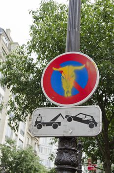 road sign in Paris street on lamp post