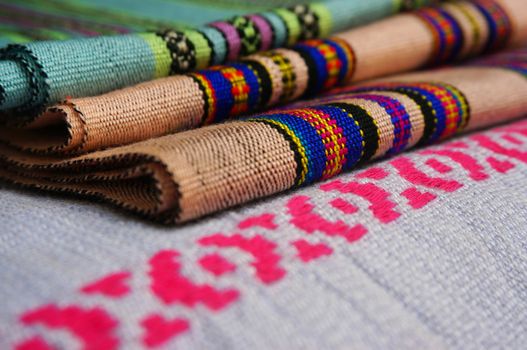 Fabric from Laos are woven using fibers with different colors, switch to a pattern.                              