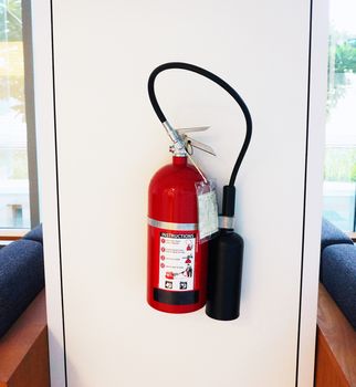 Fire extinguisher has red color, use when  happens the fire, hang it on the wall in the visible area.                              