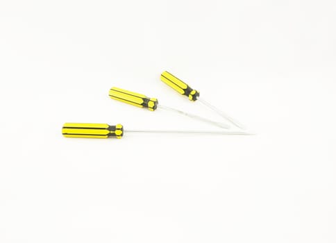 Flat-blade screwdriver with yellow handle were put together.                               