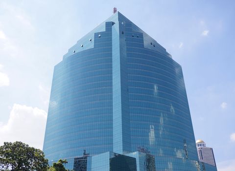 Building with blue glass skyscrapers. Reflected the sun View modernity and energetic                               