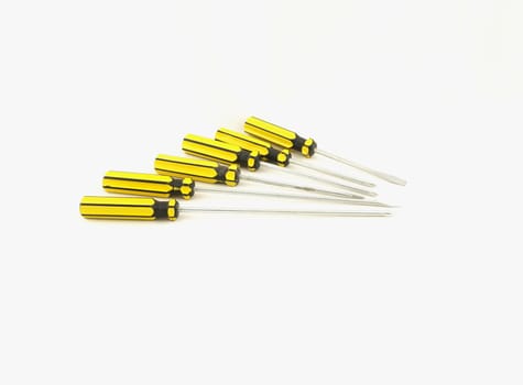 Many types of screwdrivers with yellow handle were put together.                             