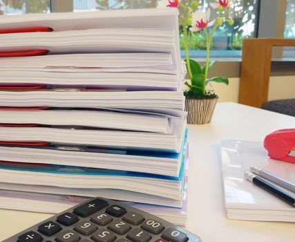 Equipment used in the office, such as pencils, paper, calculator, stapler. Placed on the desk at work.                              