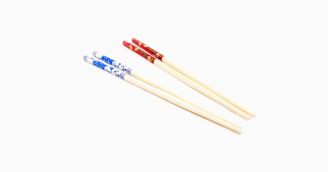 Two pairs of chopsticks put together, have two colors are red and blue.                               