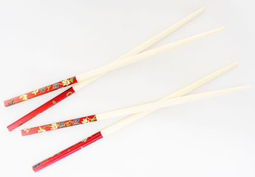 Pairs of chopsticks, made of bamboo, beautiful decoration at the handle end.                               