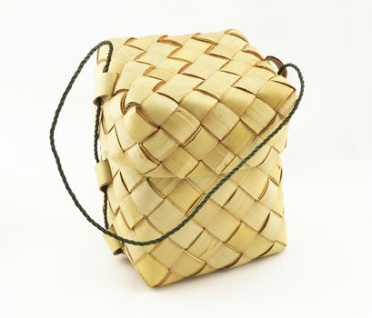 A basket weave pattern with palm leaves for the sticky rice steamed inside.                               