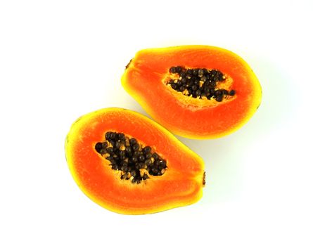Small papaya Split into two halves, bright red, thin crust, delicious flavor.                          