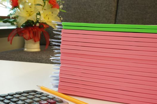 Pile of document that cover with beautiful colors of spine laid overlap on the desk in office.         