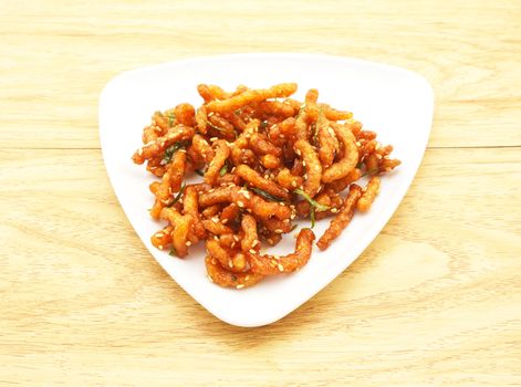 Protein crispy fried with chilli past, put the sugar and sprinkle with sesame seeds.                               