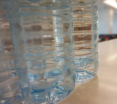 Bottles Bottled water purity, placed on the counter at work.                              