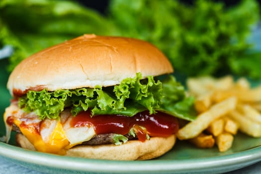 Cheeseburger, french fried and green vegetables