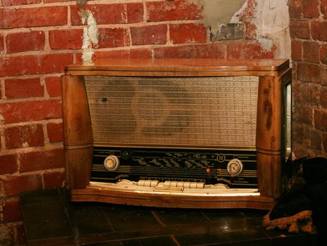 grunge wall and old radio on floor