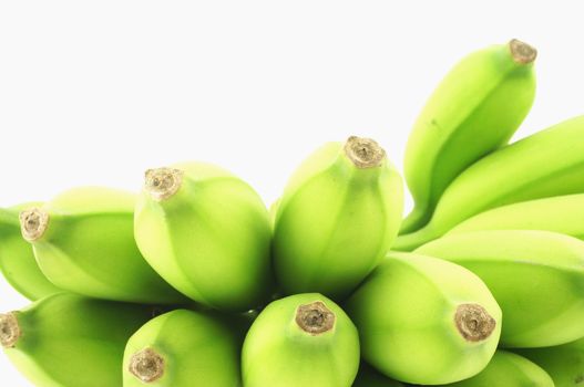 A raw banana, have large size, green colour, delicious, and beneficial to the body. Placed on a wooden table.                              