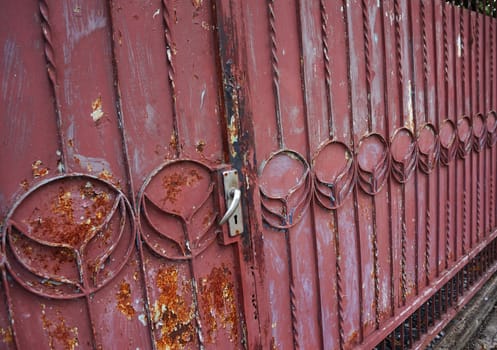 Gate made of iron when moisture from rain or the water, the peeling  take off the rust is coming.                        