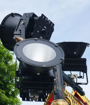 Spotlights illuminated at night, have black steel frame, set on the high places.                              