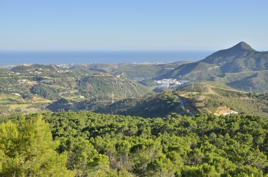 View of the village of Benahavis in Andalusia, Spain and the Mediterranean sea