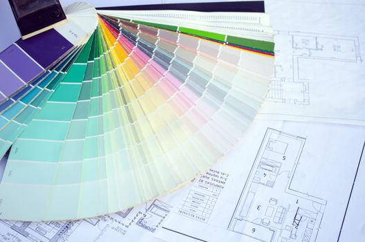 rainbow color palette samples lie on the house design drawings