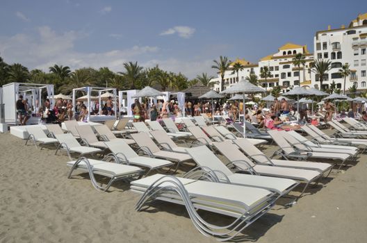 People having fun at the beach in Marbella, Spain