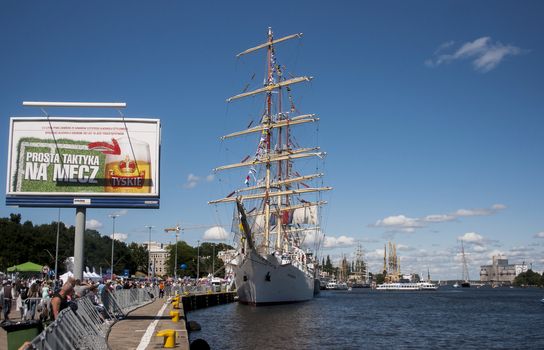 SZCZECIN, POLAND - JUNE 14, 2014: Sail Szczecin 2014.The tall masts of sailing ships fill the harbour for a wonderful three day event perfect for families and those who are sailors at heart. The event includes the largest yachts and sailing ships in the world along with Polish naval ships.It also has the sailing ship "Dar Mlodziezy".
