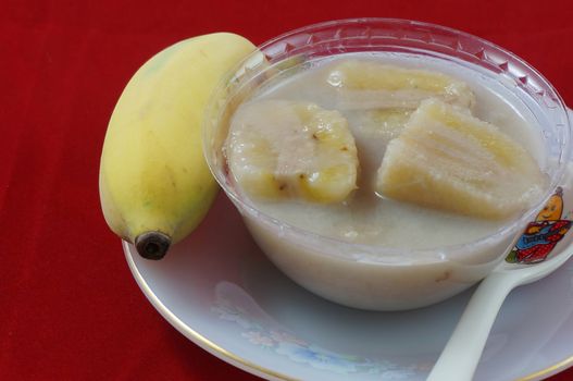 Banana in coconut milk is a sweet food of Thailand. Eaten after meals , made of Banana, cut into four parts, put into the coconut milk, add sugar and some salt                               