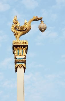 The bird lamp on high pillar, it is at the Thai temple, in Thailand                   