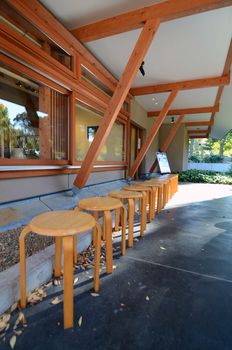 wooden chairs outside coffee shop