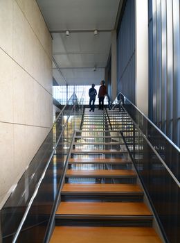 Modern metel stairs with wooden staircase in Building
