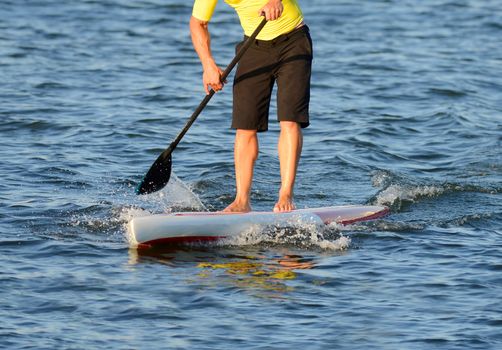 man on a paddle board in the ocean