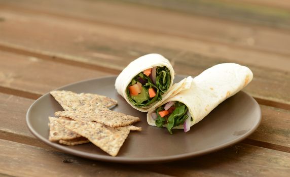 vegetarian wrap with lettuce, tomatoes and carrots