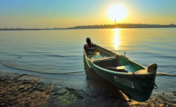 Fishing boat on the shore of Danube, at sunset